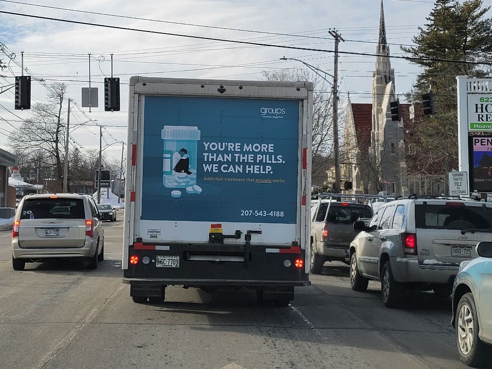 Mobile billboard on a truck in traffic
